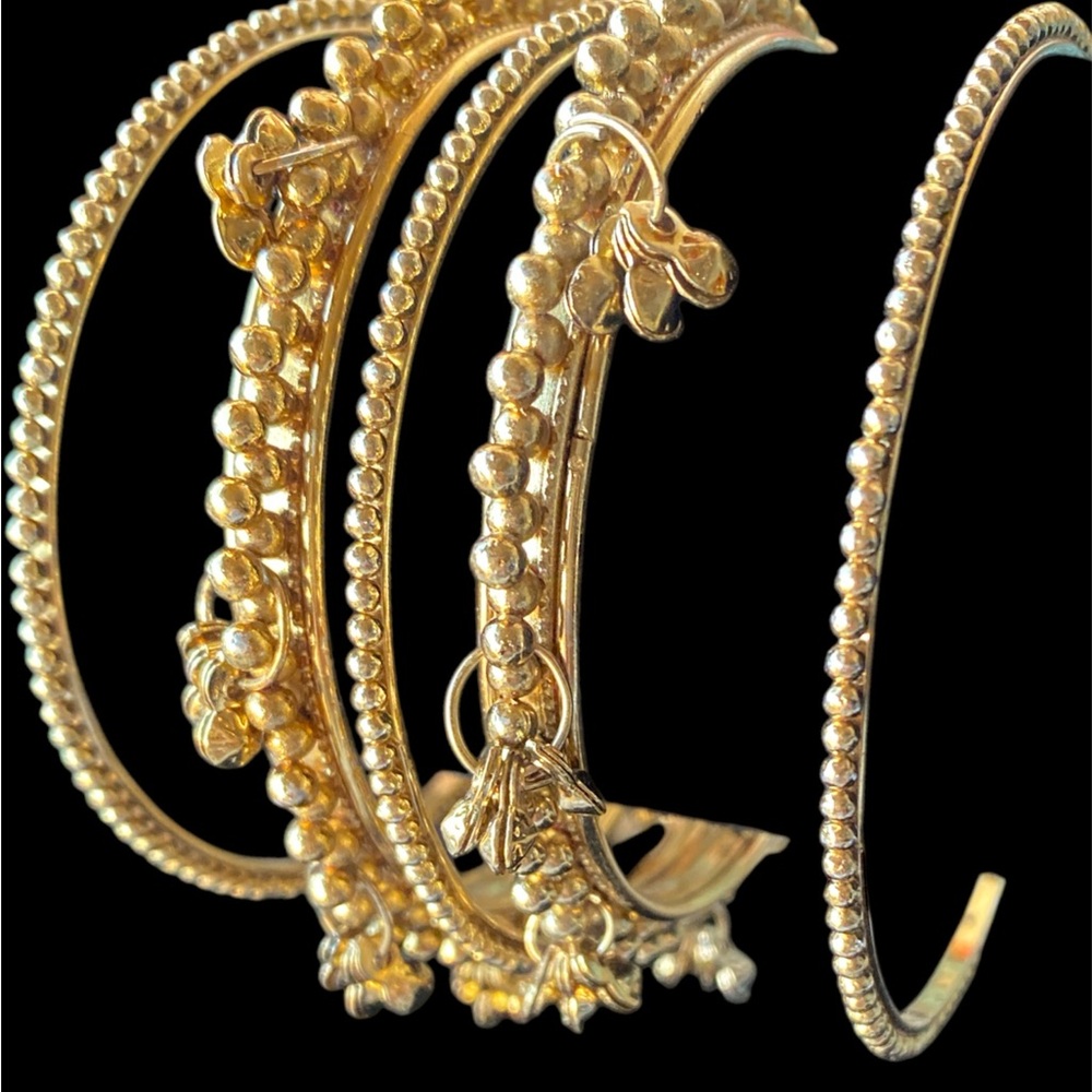 Intricate Gold Bracelets with Textured Patterns